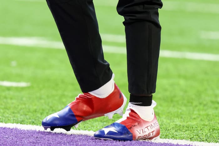 View of red, white, and blue cleats.